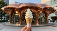sculptural copper canopy tops micro-landmark community hub in tokyo by nikken sekkei
